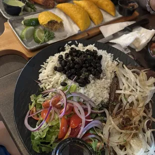 Grilled Skirt Steak ,Empanada Unidad, House Chicken Wings and more out of the photo