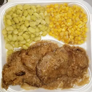 SMOTHERED steak, white rice, corn and lima beans