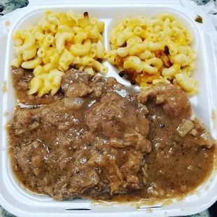 SMOTHERED pork chops, white rice, and DOUBLE mac &amp; cheese