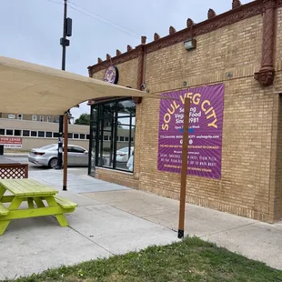 a picnic table outside a restaurant