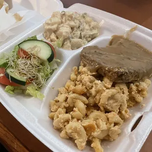 Country fried steak, Mac and cheese, potato salad and greens