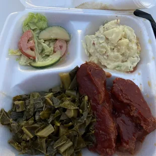 BBQ kale bone, collard greens, potato salad, and some type of salad.