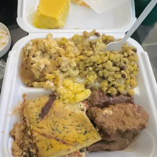 Lasagna (bottom left), kalebone (bottom right), mac and cheese (top left), black eyed peas (top right) and cornbread