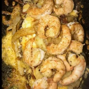 shrimp and eggs in a skillet