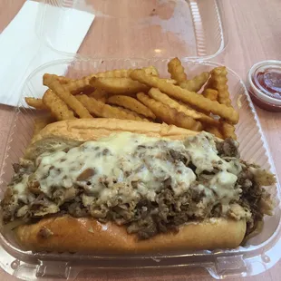 50/50 steak and chicken cheesesteak with soul fries