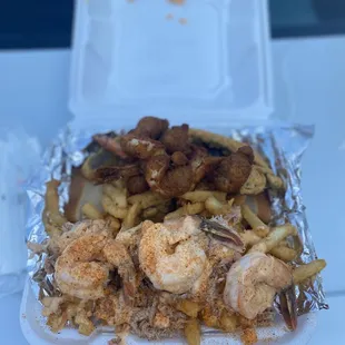 Their special I forgot the name but it cost $32 3 fried butterfly shrimp 3 cooked shrimp crab fries and whiting with white bread