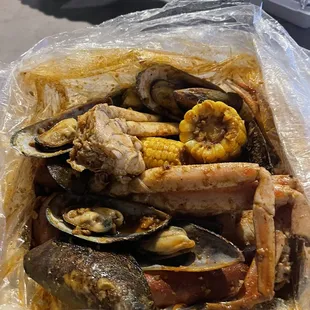 Crab legs with Mussels (Corn, potatoes and sausage come with the pot) it&apos;s enough for 2 people