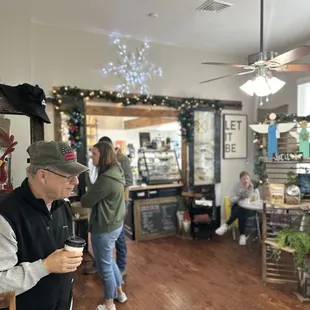 a man standing in a coffee shop
