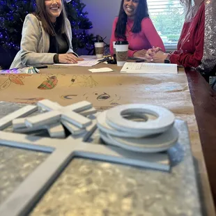 three women sitting at a table