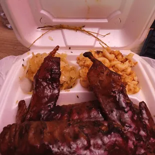 ribs and macaroni in a styrofoam container