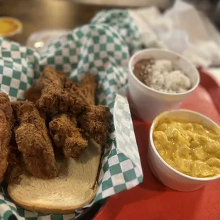 a chicken sandwich with macaroni and cheese