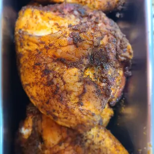 a close up of a chicken in a pan