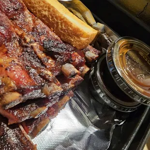a barbecue with ribs and french fries