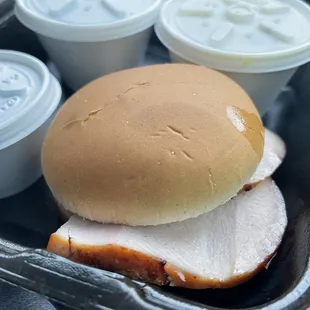 a turkey sandwich with a side of yogurt