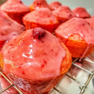 a bunch of muffins on a cooling rack