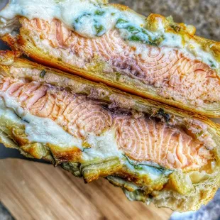 a fish sandwich on a cutting board
