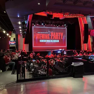 a crowd of people sitting at tables