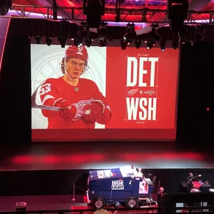 a hockey player on a big screen