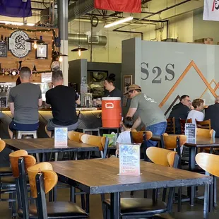 a group of people sitting at tables