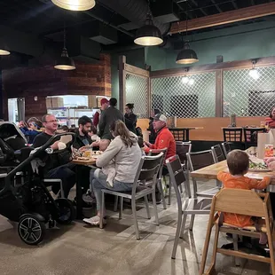 a group of people eating in a restaurant