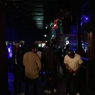 a group of people in a dark room