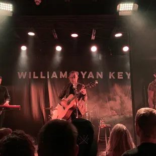 a band playing on stage at william ryan key
