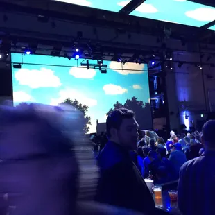 People standing and sitting. No guaranteed seating