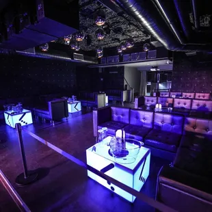 a dimly lit room with purple lighting