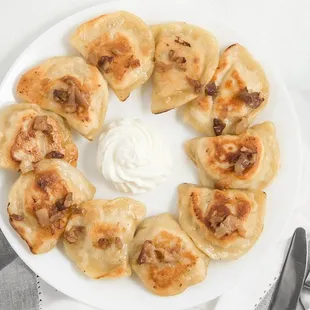 Pierogi plate. Can be with chicken, potato-cheddar, potato-onion, potato-bacon-onion, sauerkraut and sweet cherry stuffing!