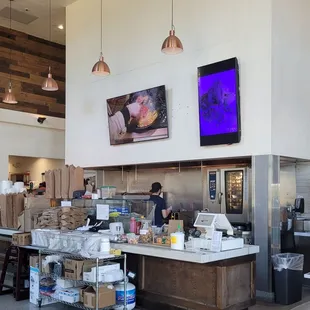 a restaurant with a large screen tv