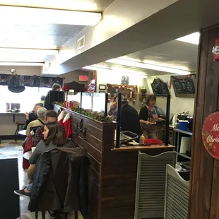 people sitting at tables in a restaurant