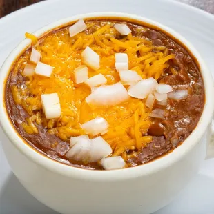 a bowl of chili and cheese