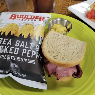 a sandwich and chips on a plate