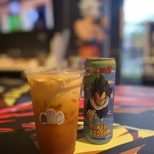 a drink and a can of power booster