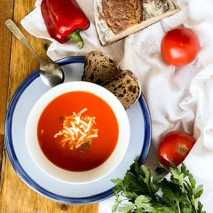 Tomato Soup - Tomato roasted red bell pepper with shredded mozzarella cheese with Acme bread.