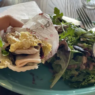 Turkey and brie sandwich with cabbage wrap and steak salad