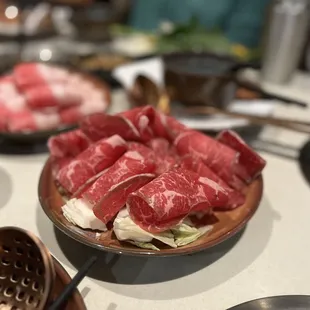 a plate of raw meat