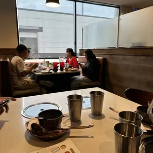 people sitting at a table in a restaurant