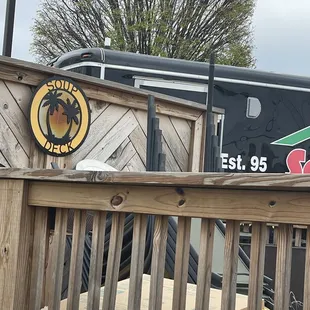 a sign on a wooden fence