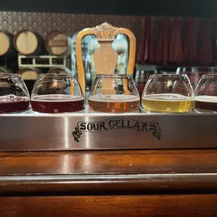 a flight of beer glasses