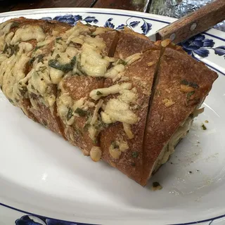 CHEESY GARLIC HASSELBACK BAGUETTE