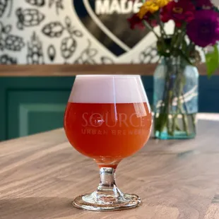 a glass of beer on a table