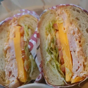 Close up on cracked pepper turkey & cheddar sandwich.