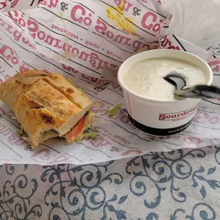 4&quot; cracked pepper turkey sandwich with cup of clam chowder.