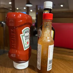 a bottle of ketchup next to a bottle of ketchup