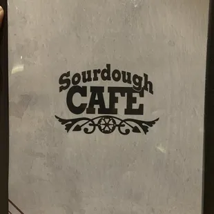 a hand holding a sign