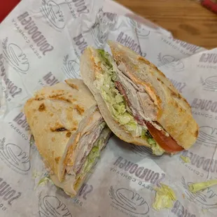 Garlic pesto turkey sandwich on classic sourdough - lots of tasty sauce!