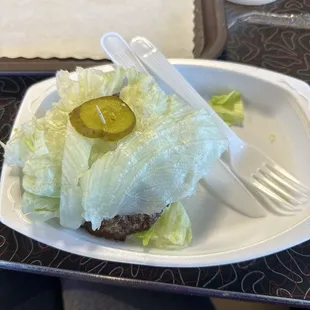 Hamburger in lettuce wrap.