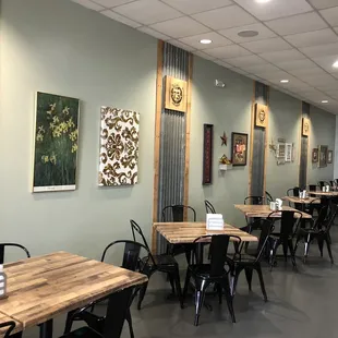 tables, chairs, and artwork