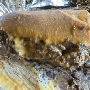 Cheesesteak with wiz, fried onions, and mushrooms